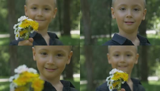 特写的小孩抱着和给予一束花，并提供他们高清在线视频素材下载
