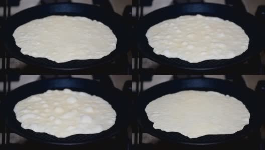 用热锅煮的白玉米玉米饼。高清在线视频素材下载