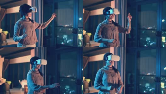 一位亚洲华裔少女戴上VR眼镜，在客厅体验3D虚拟游戏体验高清在线视频素材下载