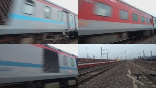 加尔各答Rajdhni -12301(豪拉交叉口至新德里)。在郊区铁路枢纽站的铁轨上运行的印度高速火车。印度加尔各答，西孟加拉邦高清在线视频素材下载