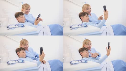 护士在医院里用躺在床上的手机自拍照顾一个孩子高清在线视频素材下载