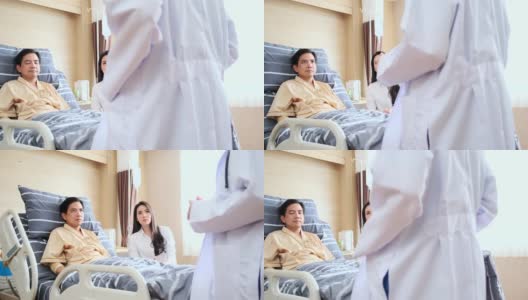 亚洲职业女医生在医院病房向病人解释。病人和他的妻子已经了解了所有的信息高清在线视频素材下载