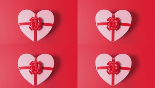 Loop Ready Love is Coming Out of a Heart Shape White Gift Box with Red Ribbon on Red Loop Ready File in 4K分辨率高清在线视频素材下载