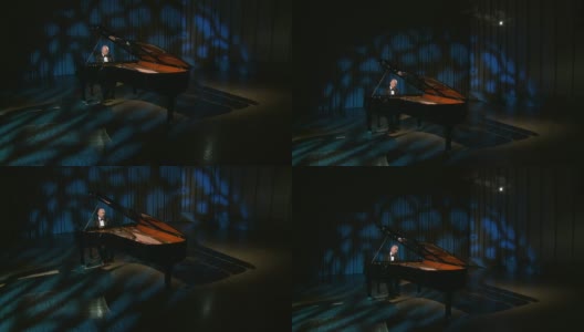 HD CRANE:弹奏大钢琴的人高清在线视频素材下载