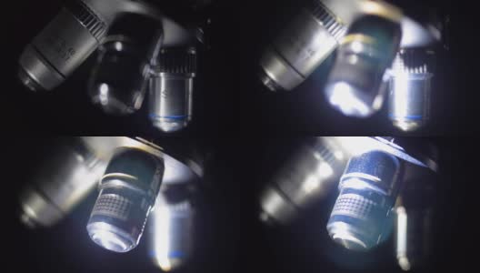 移动的光捕捉到显微镜的目标，它们发出光高清在线视频素材下载