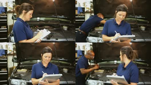 男，女机械师一起在汽车修理厂工作。高清在线视频素材下载