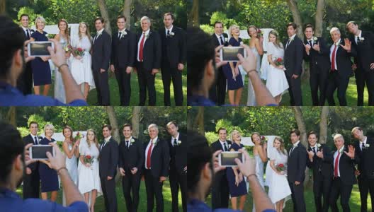 摄影师为新郎新娘和家人拍照4K 4K高清在线视频素材下载
