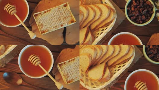 蜂蜜壶和长柄勺在乡村的桌子上，面包，葡萄干和蜂蜜梳子，俯视图高清在线视频素材下载