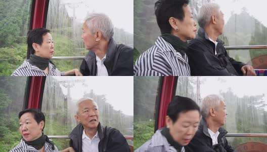 亚洲老年夫妇乘索道缆车上山为退休旅行高清在线视频素材下载