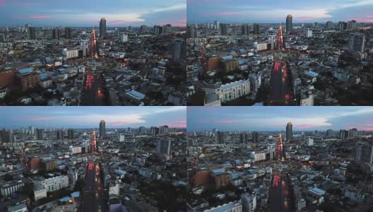 日落时城市的鸟瞰图。飞越泰国曼谷巨大的回旋处高清在线视频素材下载