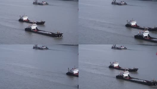 黄浦江货轮的实时航拍/中国上海高清在线视频素材下载