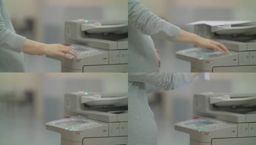中国怀孕的办公室妇女在用复印机高清在线视频素材下载