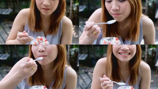 4K拍摄:特写亚洲女人的嘴正在咖啡馆吃奶油蛋糕高清在线视频素材下载