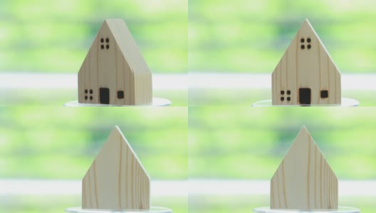 房地产概念:旋转的木屋模型展示供销售。提供抵押贷款投资和管理协议和工业建设的想法购买新房。高清在线视频素材下载