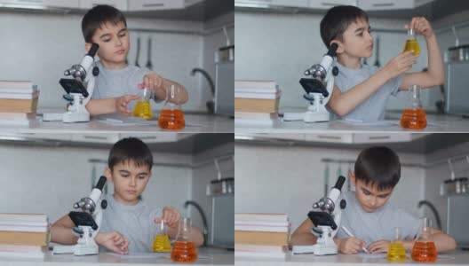 特写镜头。一个男生用显微镜和装有液体的烧瓶教化学，并在笔记本上做笔记。家庭作业高清在线视频素材下载