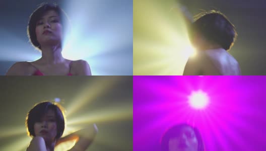 短发女人在聚光灯下跳舞高清在线视频素材下载