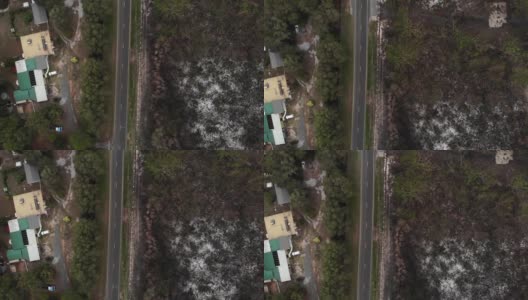 在新南威尔士州的一场森林火灾中，乡村消防部门实施了围堵线，这栋非常幸运的房子仍然屹立在那里。这是一场几乎毁坏财产的森林大火的余波高清在线视频素材下载