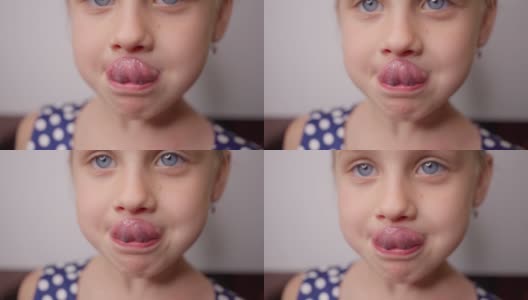 小女孩试着用舌头去够鼻子，进行言语治疗练习高清在线视频素材下载