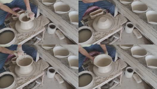亚洲华人活跃的高级陶工工作在他的工作室与纺陶轮高清在线视频素材下载