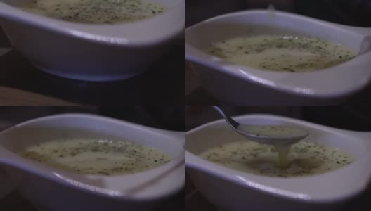 餐馆的桌子上，一盘美味的汤缓缓移动。台湾高清在线视频素材下载