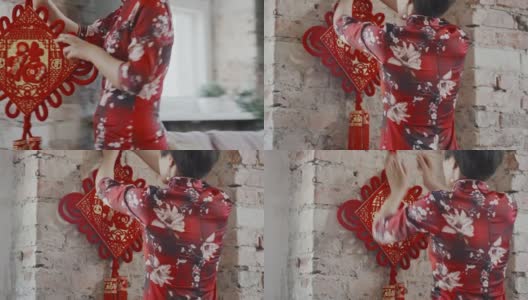 亚洲妇女悬挂中国新年装饰高清在线视频素材下载