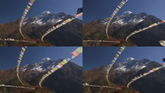 尼泊尔喜玛拉雅山脉，强风吹拂着彩旗。这面旗帜上有佛经和祷文。4 k高清在线视频素材下载