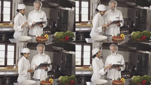 厨师长和副厨师长在厨房里策划高清在线视频素材下载
