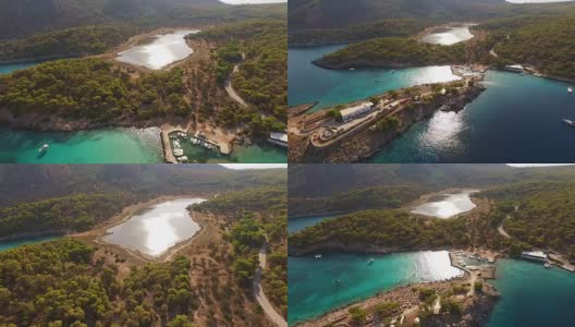 无人机拍摄的希腊萨罗尼克湾阿吉斯特里岛清澈的海水沙滩高清在线视频素材下载