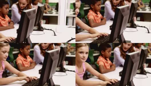 女学生在教室里使用个人电脑学习高清在线视频素材下载