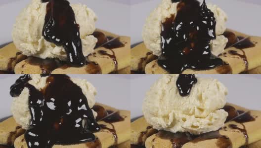 将美味的巧克力糖浆浇在手指饼干和冰淇淋上高清在线视频素材下载