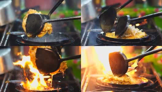 FHD的慢镜头特写烹饪炸虾铲子炒锅在锅上炒，泰国传统食物，亚洲食物高清在线视频素材下载