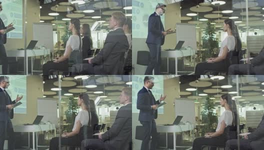 男性高管在同事面前演讲高清在线视频素材下载
