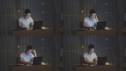 在家里工作的亚洲男人会在深夜坐在电脑前，看起来很紧张。高清在线视频素材下载