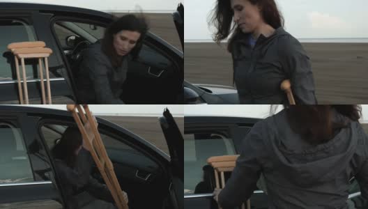 一名拄着拐杖的残疾妇女试图上车。高清在线视频素材下载