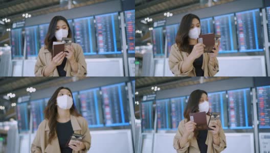 一名女乘客在机场戴着口罩发短信。高清在线视频素材下载