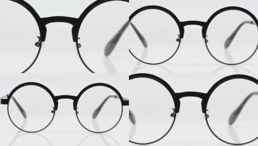 圆形黑色眼镜在白色背景，黑色眼镜圆形运动- 4k 3840 × 2160,360度旋转。高清在线视频素材下载