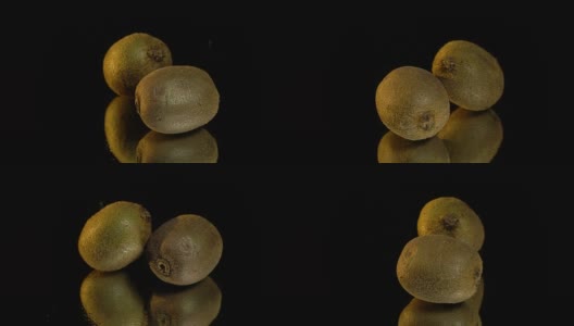 两个棕色猕猴桃在展示桌上高清在线视频素材下载