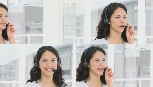 在呼叫中心工作的微笑女人高清在线视频素材下载