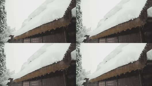 在雪下的白川村，屋顶上的冰冻矛高清在线视频素材下载