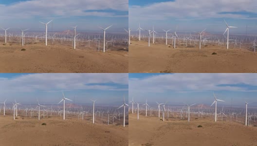空中拍摄的巨大的风力涡轮机领域从俯视创造清洁的可再生能源高清在线视频素材下载