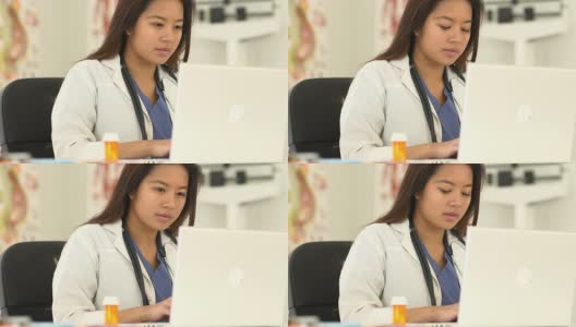 一个中国医生在用笔记本电脑工作高清在线视频素材下载