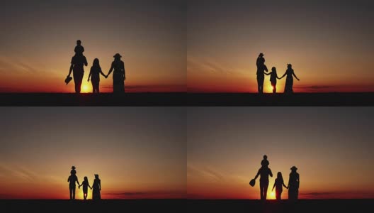 夕阳下幸福的一家人散步的剪影高清在线视频素材下载