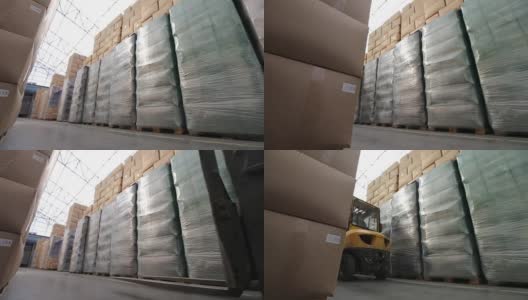 装着箱子的铲车在工业仓库里高清在线视频素材下载