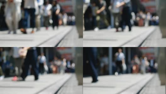 在日本大阪车站的高峰时段，一群无名的人走在人行道上高清在线视频素材下载
