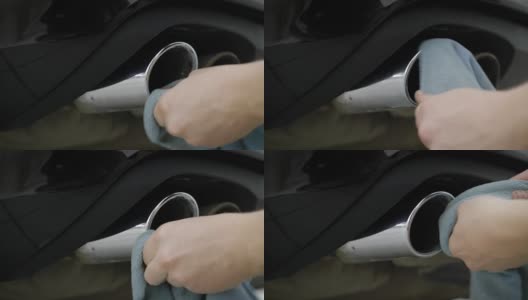 人擦拭，清洁和抛光布铬排气管现代汽车，特写高清在线视频素材下载