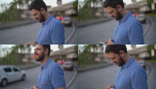用智能手机等车的男人高清在线视频素材下载