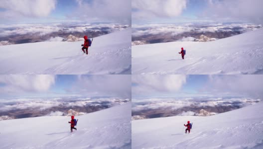 年长的高山攀登者正在冬季攀登高海拔山脉的顶峰高清在线视频素材下载