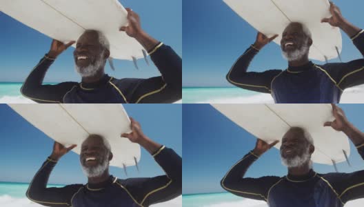 一个在海滩上拿着冲浪板的老人高清在线视频素材下载