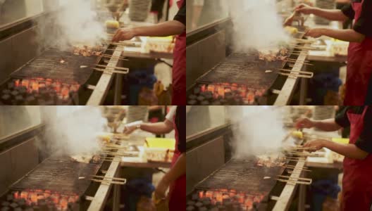 侧面的肉和鸡肉沙嗲烤热木炭高清在线视频素材下载