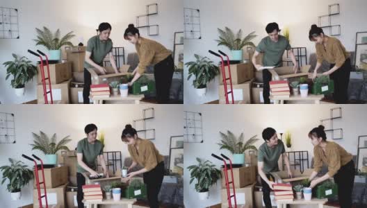 一对日本夫妇搬进新公寓，慢动作录像高清在线视频素材下载